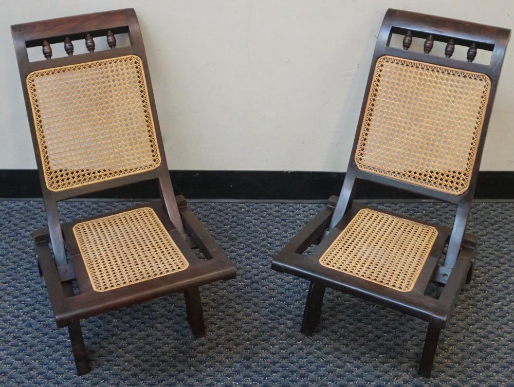 Appraisal: PAIR ASIAN ROSEWOOD CANE SEAT FOLDING CHAIRSPair Asian Rosewood Cane