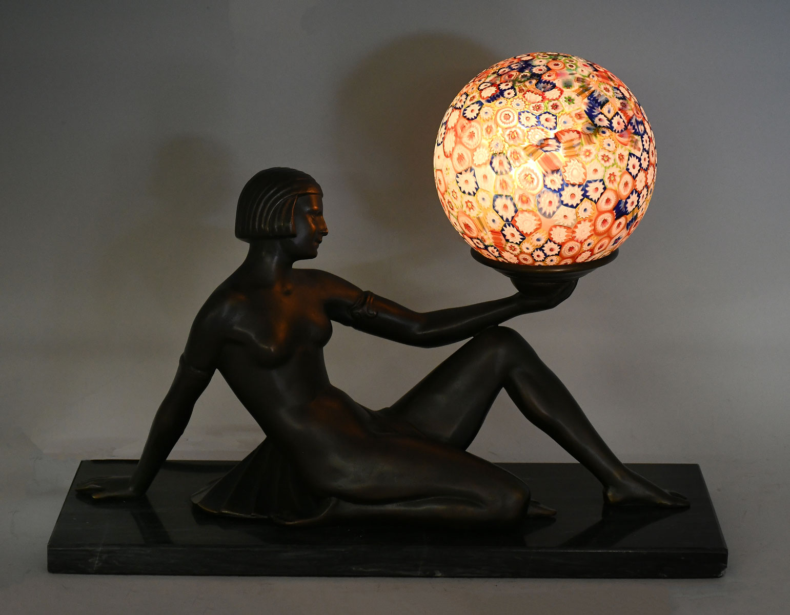 Appraisal: BRONZE ART DECO NUDE LAMP WITH MILLEFIORI SHADE Bronze Egyptian