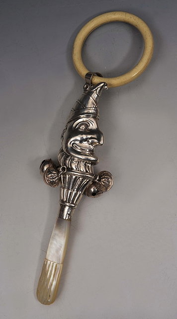 Appraisal: AN EDWARDIAN SILVER BABY'S RATTLE in the form of Mr