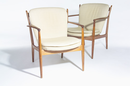 Appraisal: FINN JUHL Pair of armchairs with contoured armrests and beige