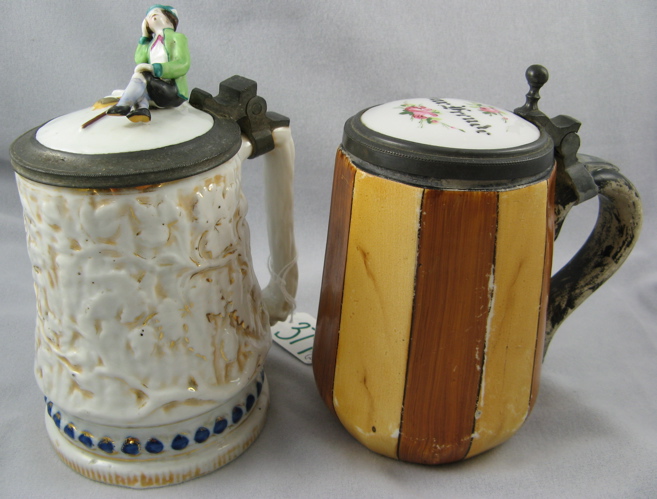 Appraisal: TWO GERMAN POTTERY BEER STEINS One of glazed flower and