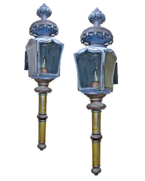 Appraisal: A pair of brass mounted carriage lamps Each torch form