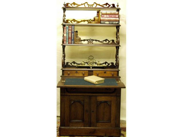 Appraisal: Victorian walnut Renaissance Revival bookcase combination drop front desk Features