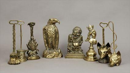 Appraisal: Eight English Brass Doorstops to in