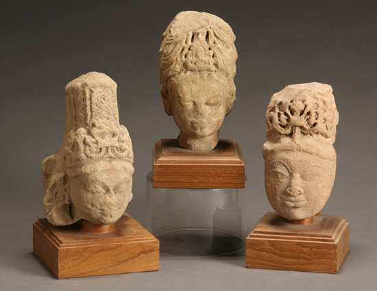 Appraisal: Three Central Indian Buff Sandstone Heads of Crowned Divinities Madhya