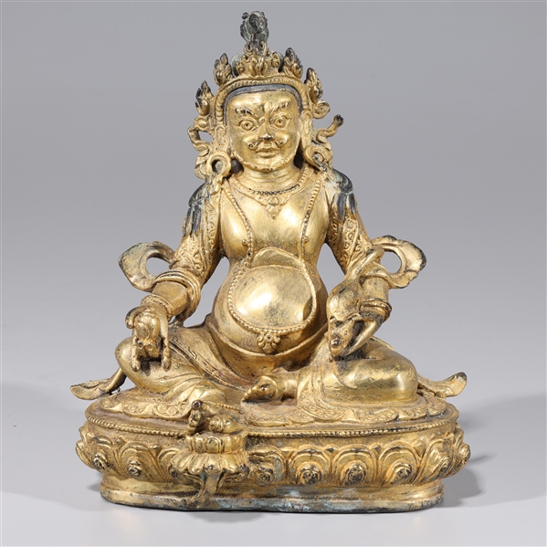 Appraisal: Sino-Tibetan gilt bronze seated Kubera figure on lotus base Kubera