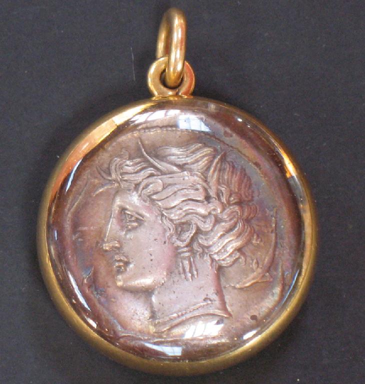 Appraisal: A ROMAN COIN mounted in a double glass bezel set