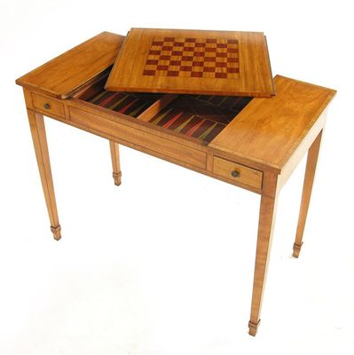 Appraisal: A continental satinwood games table with tulipwood banding the sliding