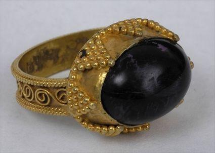 Appraisal: PERSIAN GRANULATED GOLD AND AMETHYST RING Size Provenance Property from