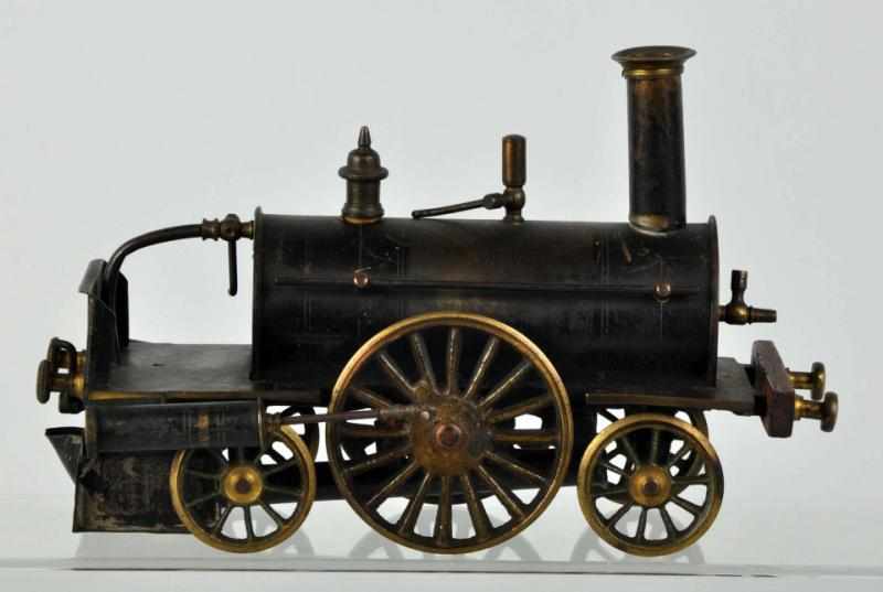 Appraisal: Early Steam-Type Train Engine American Turn-of-the-century model made of tin