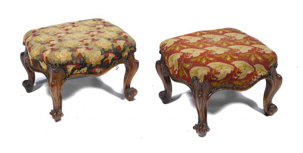 Appraisal: A PAIR OF VICTORIAN WALNUT FOOTSTOOLS on scrolling legs and