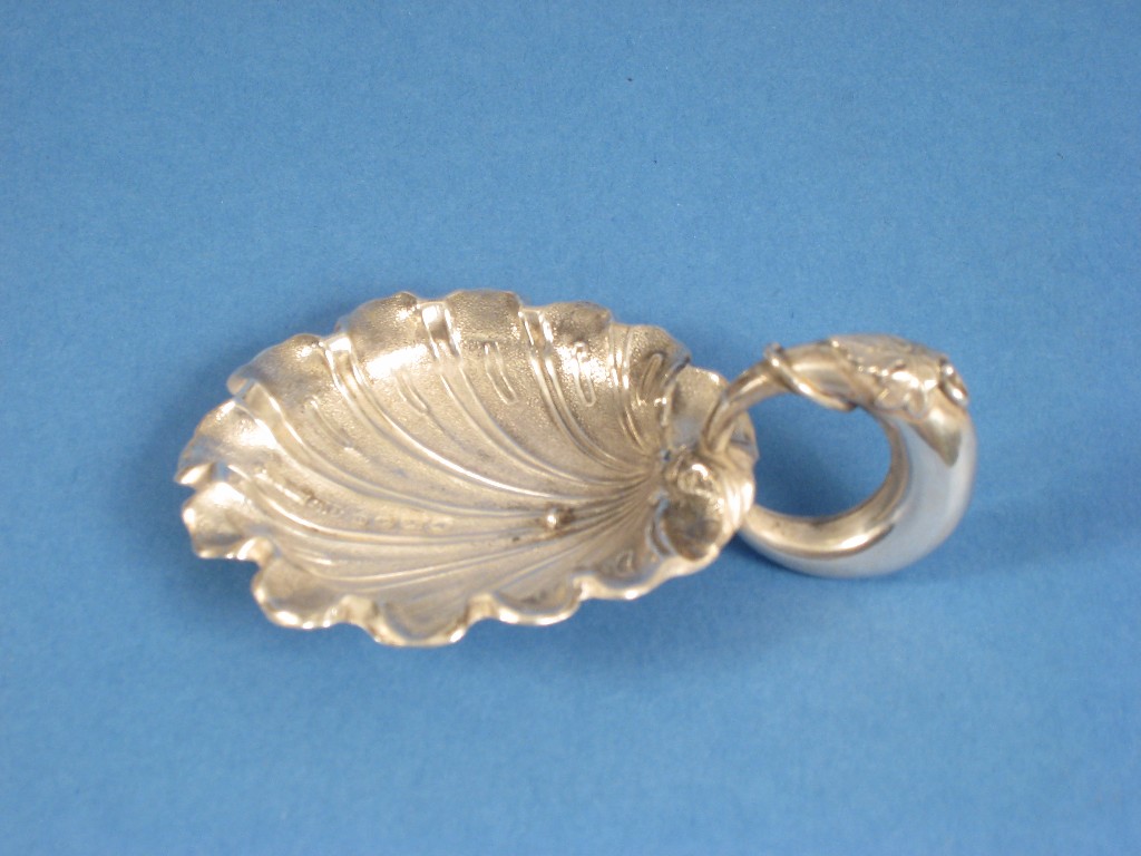 Appraisal: A Victorian Caddy Spoon with scallop bowl leafage entwined loop