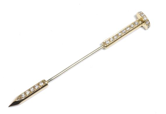 Appraisal: A DIAMOND JABOT PIN Yellow and white gold Small jabot