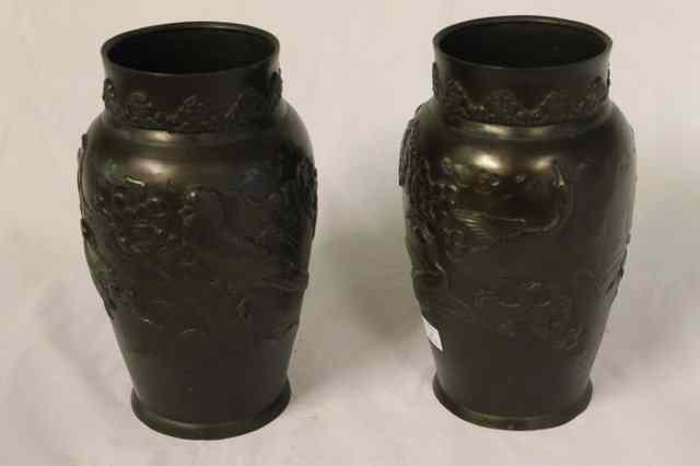 Appraisal: A PAIR OF JAPANESE BRONZE VASES with raised bird and