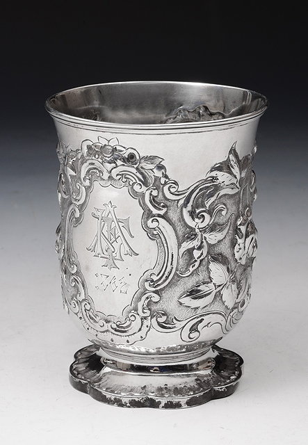 Appraisal: A VICTORIAN SILVER TUMBLER CUP with chased foliate decoration and