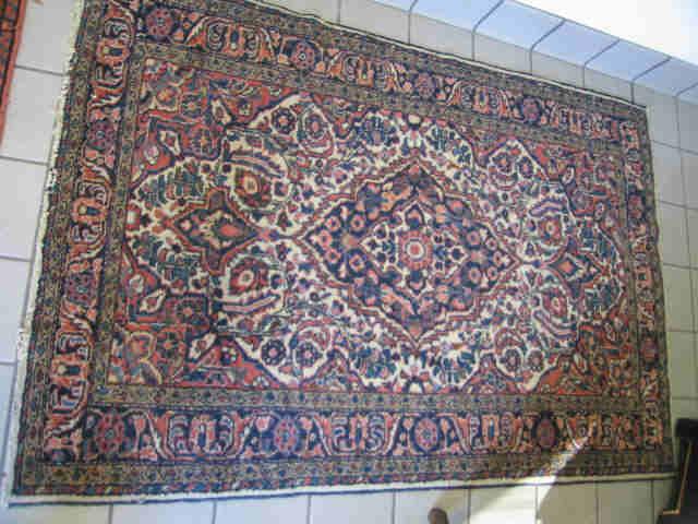 Appraisal: Mahal Persian Handmade Rug primarily reds blues on ivory field