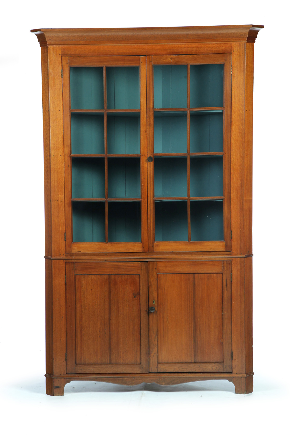 Appraisal: ONE-PIECE SIXTEEN-PANE CORNER CUPBOARD American mid th century walnut with