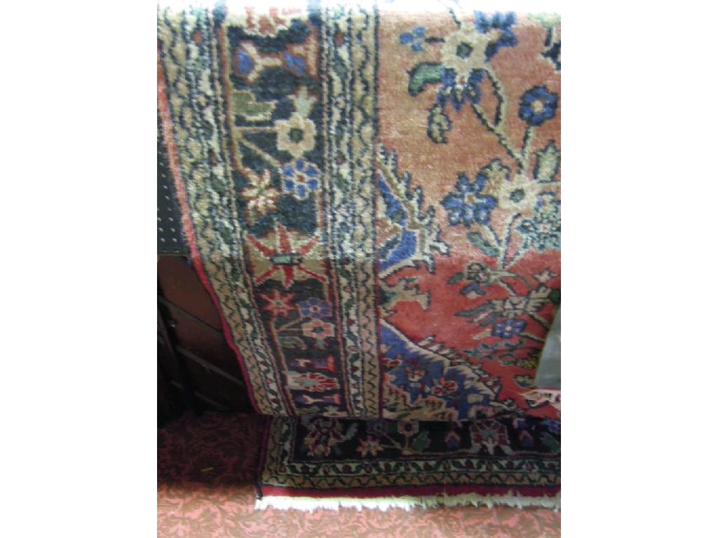 Appraisal: A large Persian style carpet with an overall floral pattern