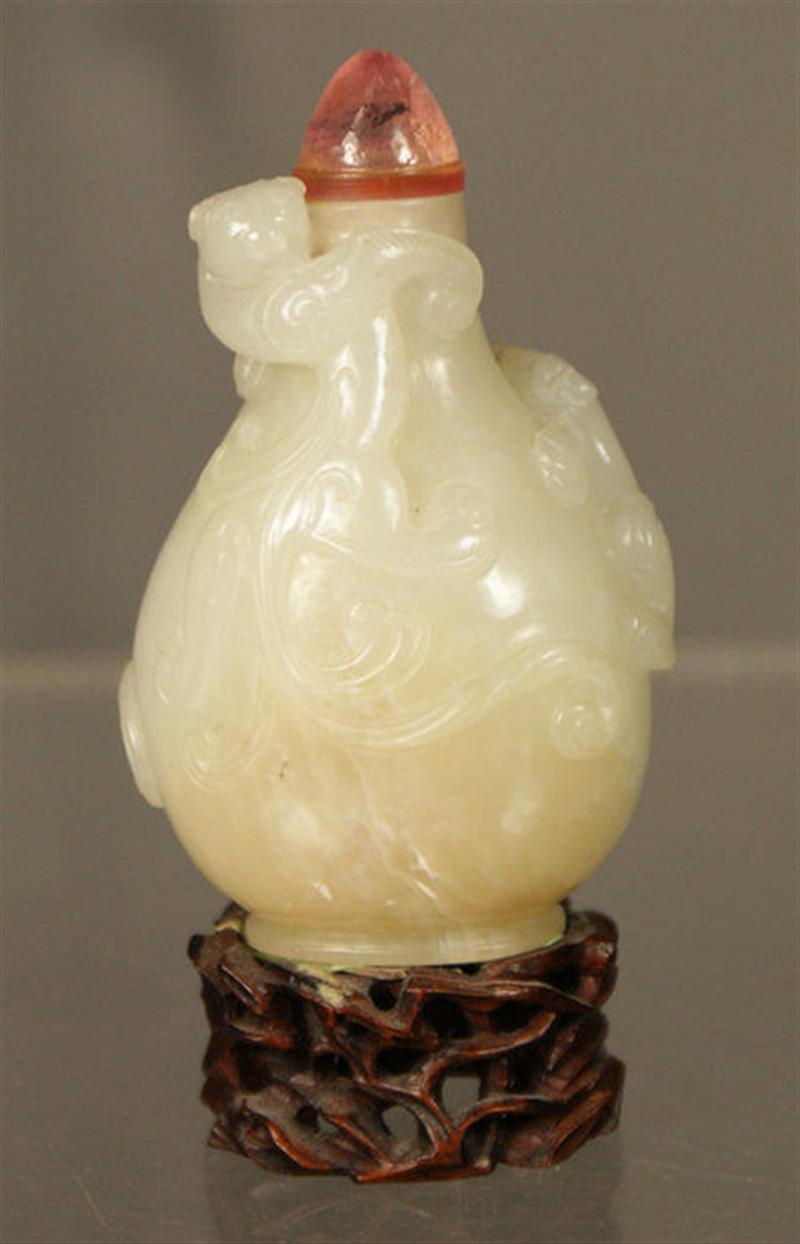 Appraisal: Carved jadeite snuff bottle body wrapped with foo lions amethyst