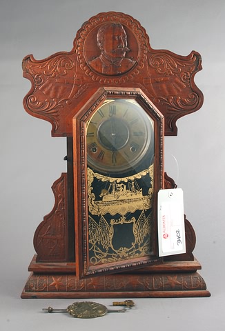 Appraisal: E Ingraham Oak Mantel clock Spanish-American War theme day time