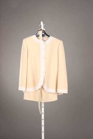 Appraisal: Andr Laug cream yellow wool skirt suit with belt Approx