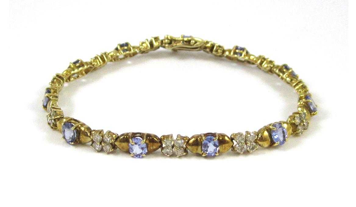 Appraisal: TANZANITE DIAMOND AND FOURTEEN KARAT GOLD BRACELET measuring inches in