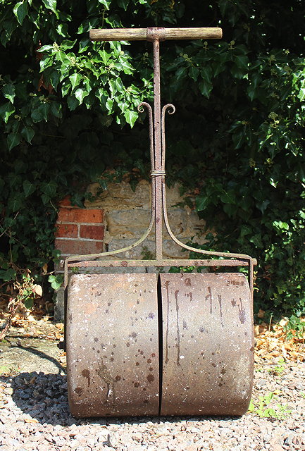 Appraisal: A PAINTED WOODEN BEEHIVE cm high and a garden roller