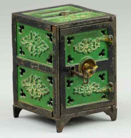 Appraisal: CLOVER AND LACE SAFE STILL BANK Very rare cast iron