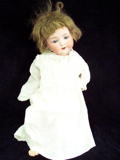 Appraisal: A German Heubach Koppelsdorf bisque head doll with blue weighted