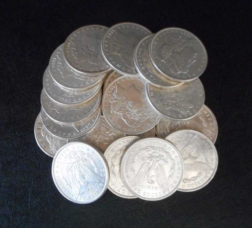 Appraisal: A ROLL OF TWENTY U S SILVER MORGAN DOLLARS all