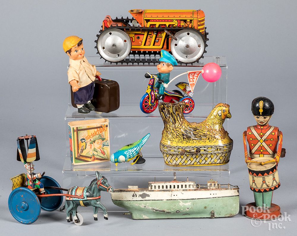 Appraisal: Group of tin lithograph wind-up toys Group of tin lithograph