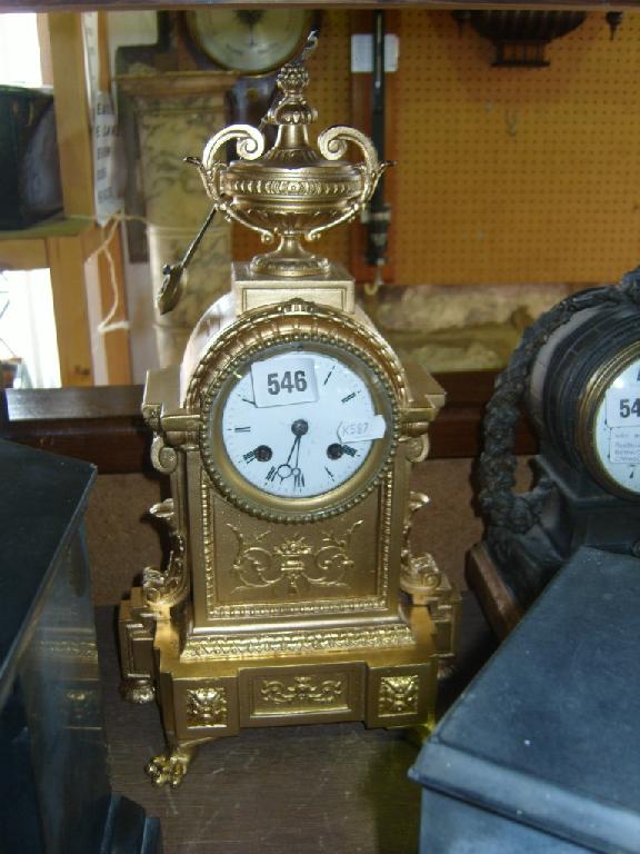 Appraisal: A mid Victorian gilded brass mantle clock of classical form