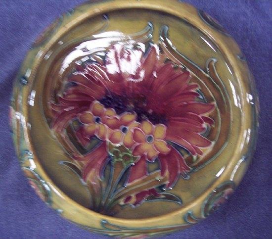 Appraisal: A Cornflower pattern shallow bowl by William Moorcroft of ochre