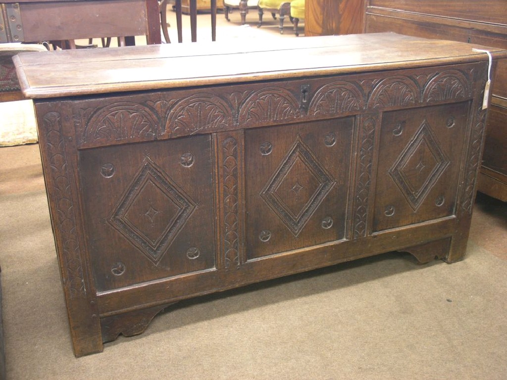 Appraisal: A late th century oak coffer boarded top above panelled