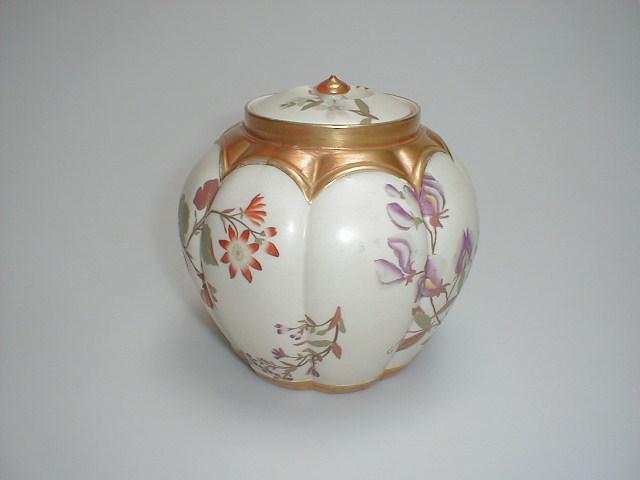 Appraisal: A Royal Worcester model lobed jar and cover hand painted