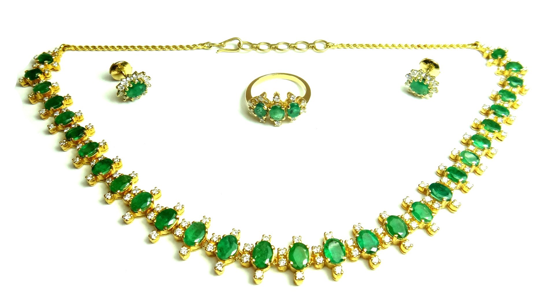 Appraisal: A gold emerald and diamond set necklace the front mounted