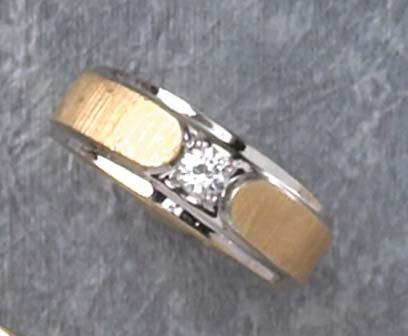 Appraisal: DIAMOND RING k two tone ring set with one round