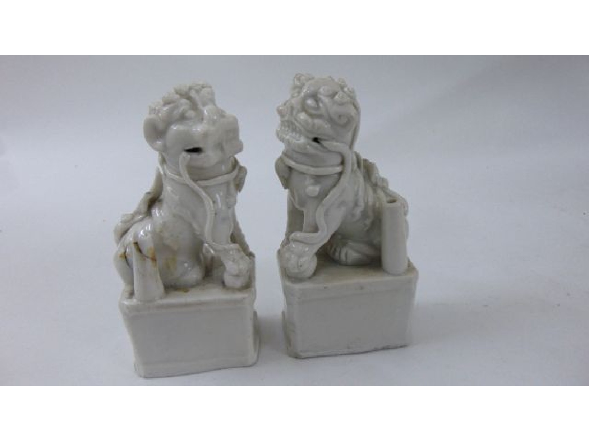 Appraisal: A pair of Chinese blanc de chine burners in the