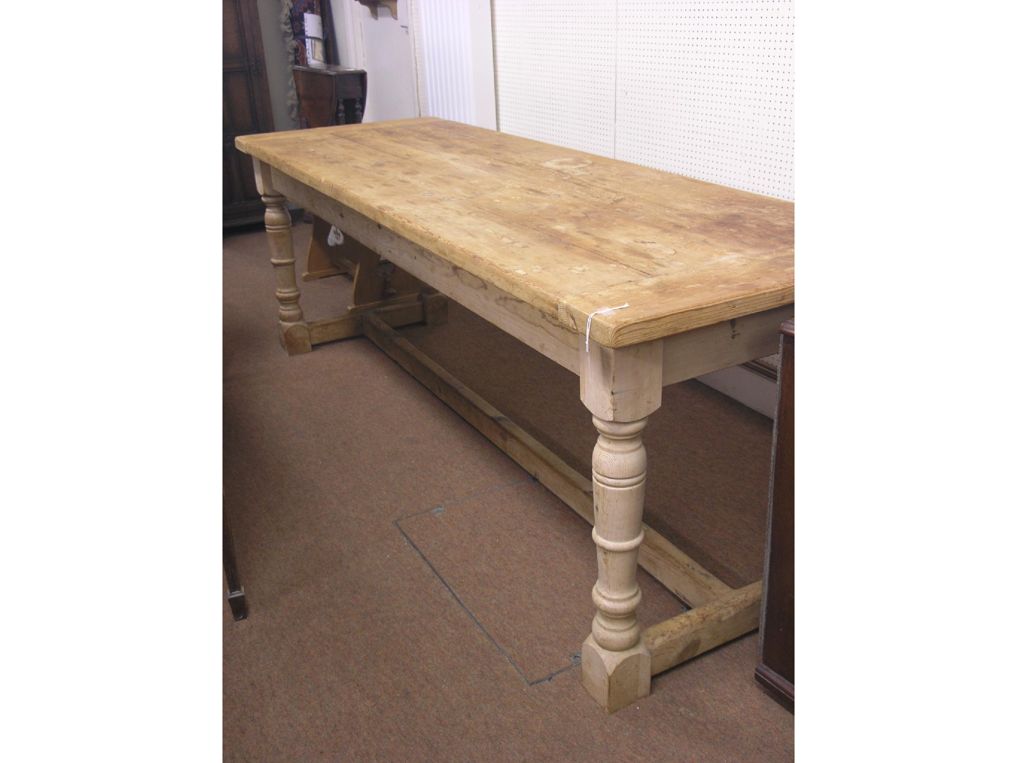 Appraisal: A large pine refectory-type dining table three-plank top on baluster-turned