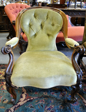 Appraisal: Victorian rosewood framed open armchair with green button back upholstery