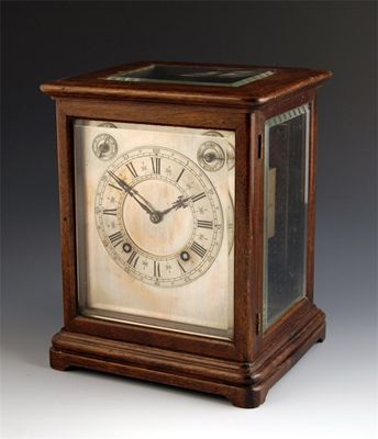 Appraisal: A German quarter striking mahogany mantel clock with a platform