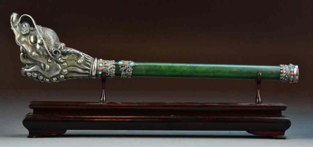 Appraisal: A Fine Tibetin Jade And Silver Mounted TrumpetThe spinach green