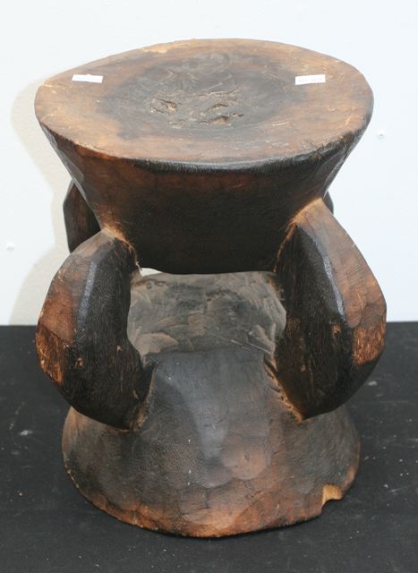 Appraisal: A tribal stool carved from one piece of wood collected