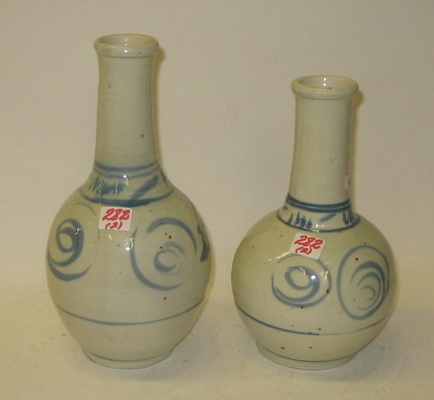 Appraisal: TWO CHINESE BLUE AND WHITE glazed earthenware vases traditional stylized