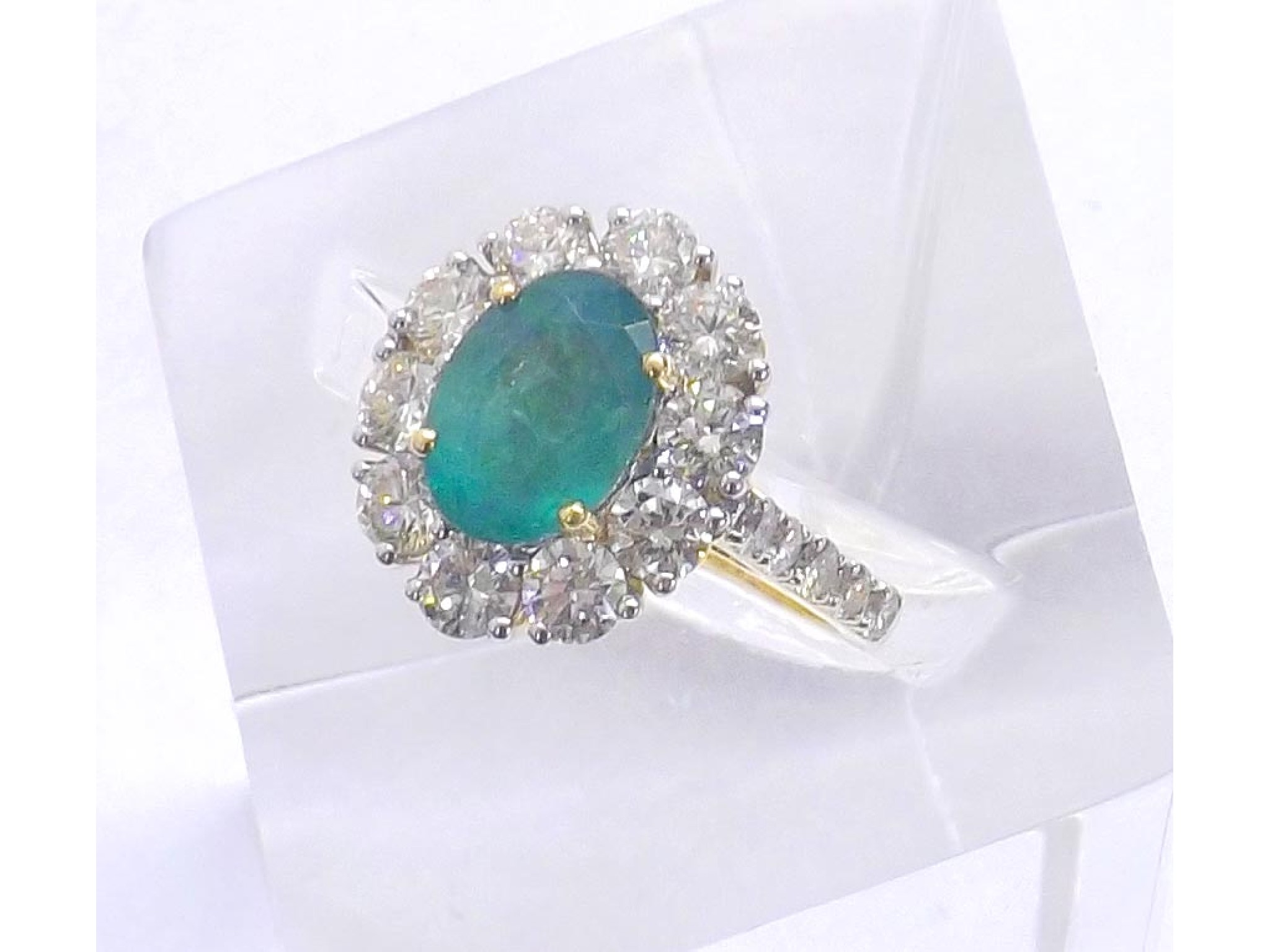 Appraisal: Impressive ct emerald and diamond oval cluster ring the oval