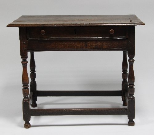 Appraisal: An early th Century oak one-drawer side table on turned