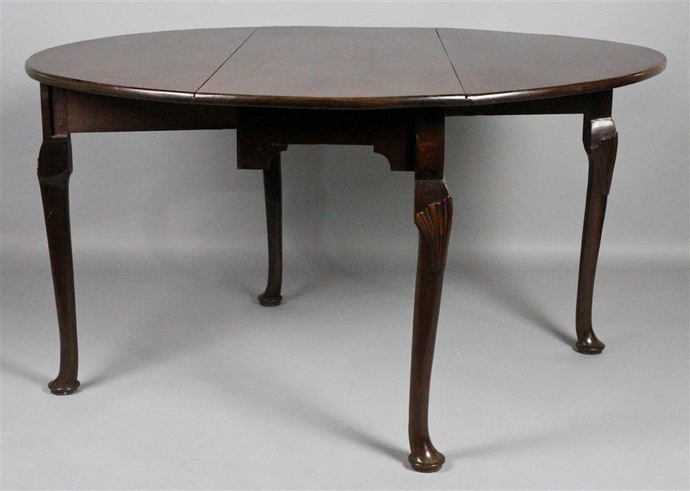 Appraisal: GEORGIAN MAHOGANY DROP LEAF TABLE WITH SHELL CARVED KNEES having