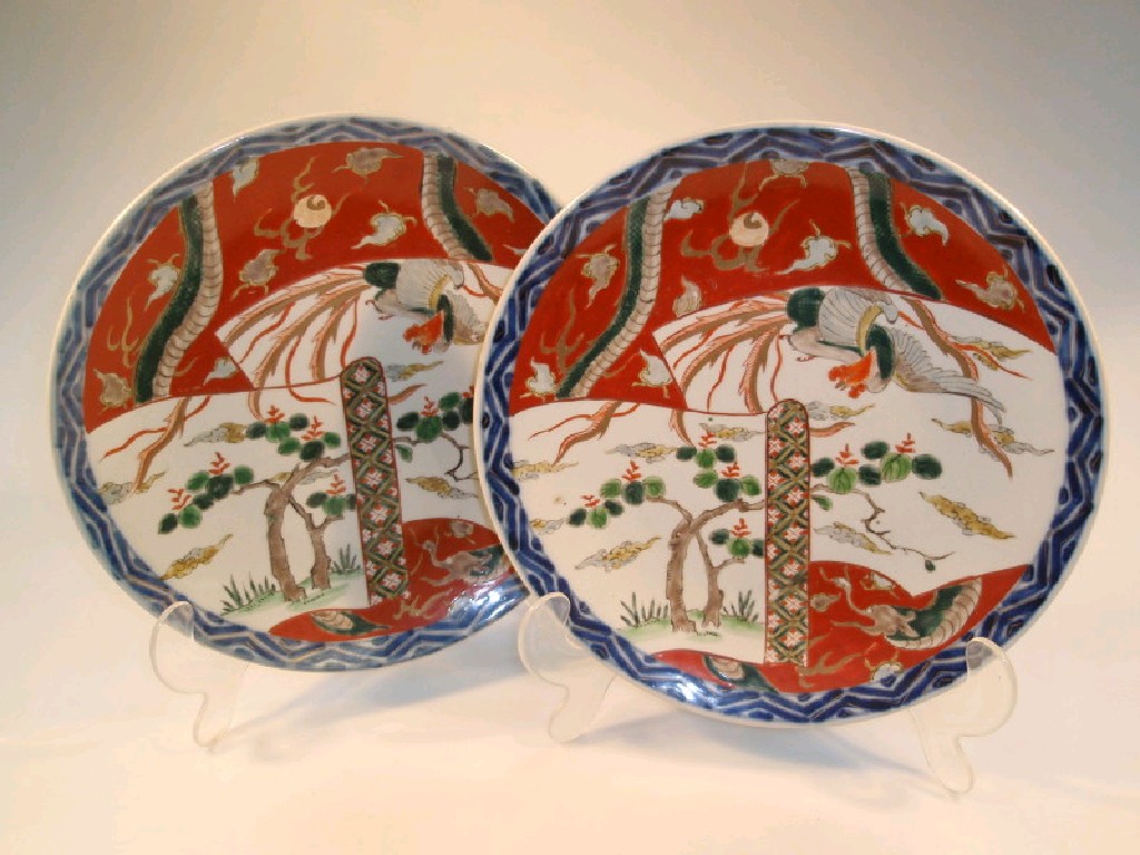 Appraisal: A pair of Imari chargers decorated with reserves of flowering