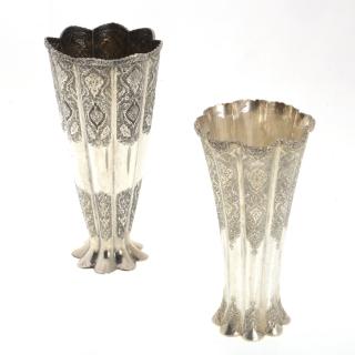 Appraisal: Persian silver fluted vases Persian silver fluted vases th th