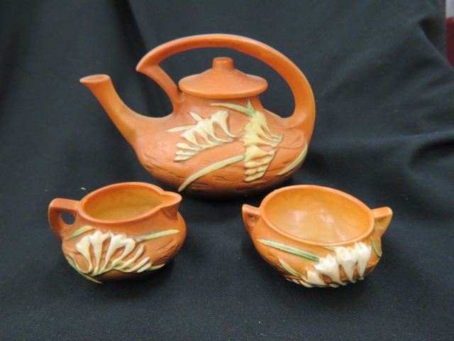 Appraisal: Roseville Pottery Freesia Tea Set brown teapot excellent